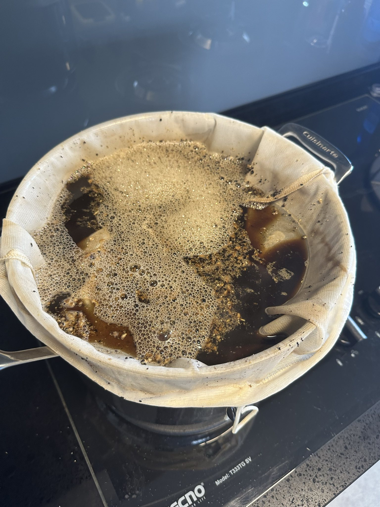 Beer being brewed on a stove top using the brew-in-a-bag technique